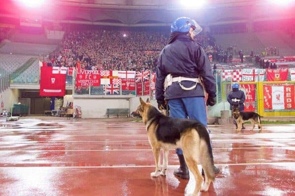 ROME, ITALY - Thursday, February 15, 2001: An Itanlian policeman and dog watches over the travelling Liverpool supporters during the UEFA Cup 4th Round 1st Leg match at the Stadio Olimpico. (Pic by David Rawcliffe/Propaganda)