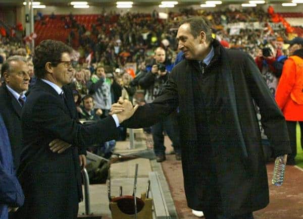 LIVERPOOL, ENGLAND - Tuesday, March 19, 2002: Liverpool's manager Gerard Houllier is embraced by AS Roma manager Fabio Capello as he returns to the touchline after recovering from a heart attack, during the UEFA Champions League Group B match against AS Roma at Anfield. (Pic by David Rawcliffe/Propaganda)