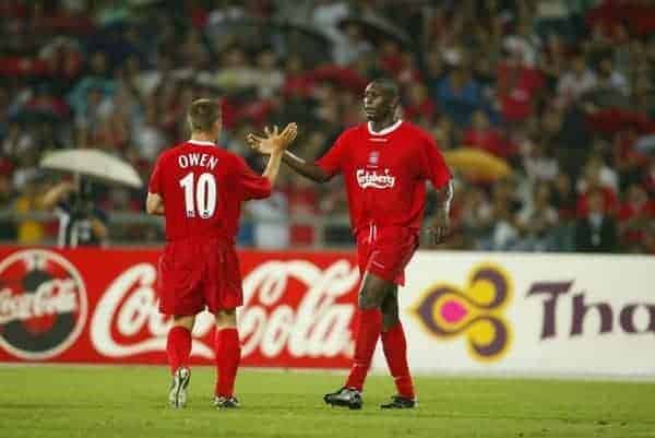 BANGKOK, THAILAND - Thailand. Thursday, July 24, 2003: Liverpool's Emile Heskey (r) celebrates his goal against Thailand with team-mate Michael Owen during a preseason friendly match at the Rajamangala National Stadium. (Pic by David Rawcliffe/Propaganda)