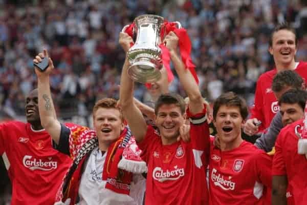 CARDIFF, WALES - SATURDAY, MAY 13th, 2006: Liverpool's captain Steven Gerrard lifts the FA Cup surrounded by team-mates L-R Momo Sissoko, John Arne Riise and Xabi Alonso after beating West Ham United on penalties during the FA Cup Final at the Millennium Stadium. (Pic by David Davies/Pool/Propaganda)