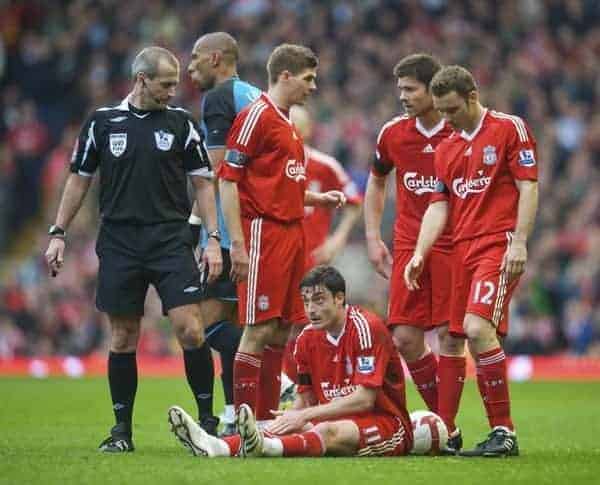 LIVERPOOL, ENGLAND - Sunday, March 22, 2009: Liverpool's Albert Riera is left on the floor after a nasty tackle by Aston Villa's John Carew during the Premiership match at Anfield. (Photo by David Rawcliffe/Propaganda)