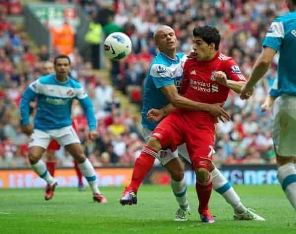 LIVERPOOL, ENGLAND - Saturday, August 13, 2011: Liverpool's Luis Alberto Suarez Diaz in action against Sunderland's Wes Brown during the Premiership match at Anfield. (Pic by David Rawcliffe/Propaganda)