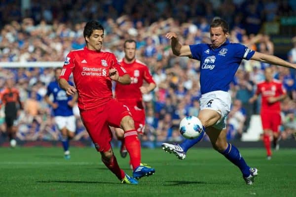 LIVERPOOL, ENGLAND - Saturday, October 1, 2011: Liverpool's Luis Alberto Suarez Diaz in action against Everton's Phil Jagielka during the Premiership match at Goodison Park. (Pic by David Rawcliffe/Propaganda)