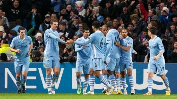 MANCHESTER, ENGLAND - Wednesday, December 7, 2011: Manchester City's Edin Dzeko and Joleon Lescott celebrate their side's first goal against FC Bayern Munchen during the UEFA Champions League Group A match at the City of Manchester Stadium. (Pic by Vegard Grott/Propaganda)