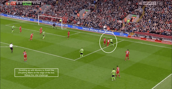 Doubling up with Moreno to thwart the onrushing Mane on the edge of the box. Makes the vital challenge.