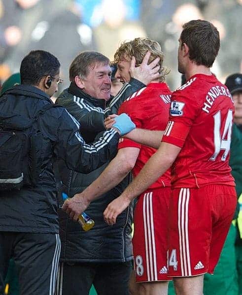 LIVERPOOL, ENGLAND - Saturday, January 28, 2012: Liverpool's manager Kenny Dalglish celebrates with match-winner Dirk Kuyt after the 2-1 victory over Manchester United during the FA Cup 4th Round match at Anfield. (Pic by David Rawcliffe/Propaganda)