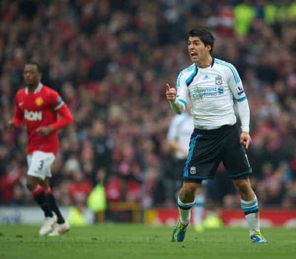 MANCHESTER, ENGLAND - Saturday, February 11, 2012: Liverpool's Luis Alberto Suarez Diaz can't believe he wasn't awarded a free-kick during the Premiership match against Manchester United at Old Trafford. (Pic by David Rawcliffe/Propaganda)