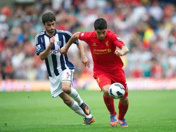 WEST BROMWICH, ENGLAND - Saturday, August 18, 2012: Liverpool's Luis Alberto Suarez Diaz in action against West Bromwich Albion's Claudio Yacob during the opening Premiership match of the season at the Hawthorns. (Pic by David Rawcliffe/Propaganda)