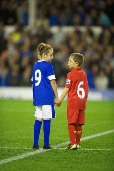 LIVERPOOL, ENGLAND - Monday, September 17, 2012: Mascots Beth Garner-Watt, 11, and Mikey Clarke, 8, stand for a minute's applause to remember the 96 victims of the Hillsborough Stadium Disaster before the Premiership match between Everton and Newcastle United at Goodison Park. (Pic by David Rawcliffe/Propaganda)