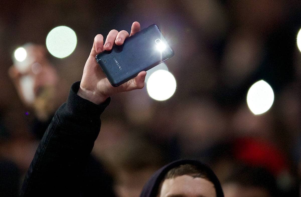 LONDON, ENGLAND - Friday, January 24, 2014: Fans use their mobile phone flashlights as part of the floodlights fail as Arsenal take on Coventry City during the FA Cup 4th Round match at the Emirates Stadium. (Pic by David Rawcliffe/Propaganda)