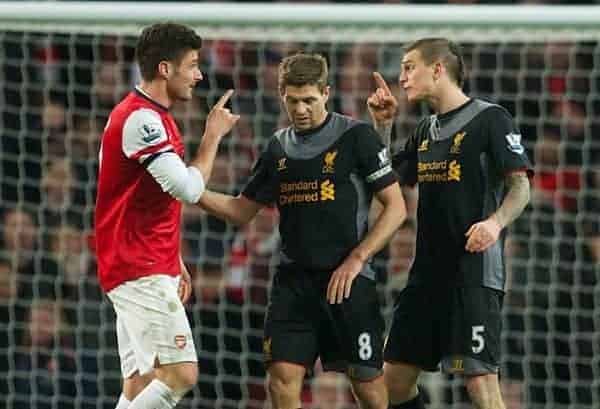 LONDON, ENGLAND - Wednesday, January 30, 2013: Liverpool's Daniel Agger and Arsenal's Oliver Giroud clash during the Premiership match at the Emirates Stadium. (Pic by David Rawcliffe/Propaganda)