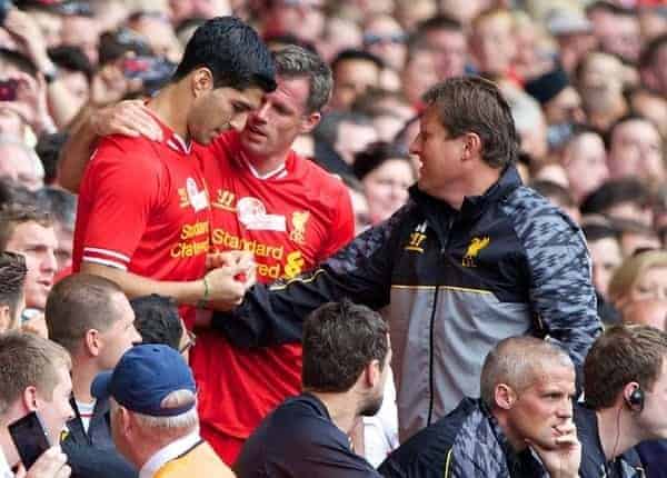 LIVERPOOL, ENGLAND - Saturday, August 3, 2013: Liverpool's Jamie Carragher and Luis Suarez during a preseason friendly match against Olympiakos CFP at Anfield. (Pic by David Rawcliffe/Propaganda)