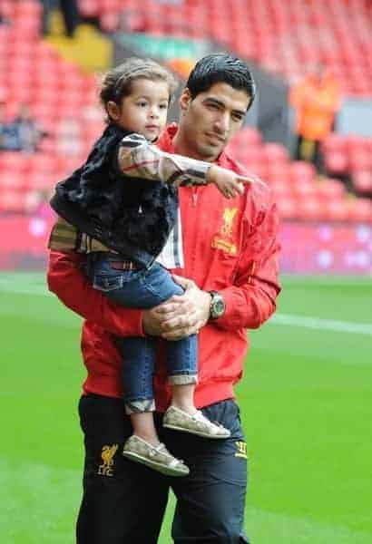 LIVERPOOL, ENGLAND - Saturday, August 17, 2013: Liverpool's Luis Suarez with his daughter Delfina before the Premiership match against Stoke City at Anfield. (Pic by David Rawcliffe/Propaganda)