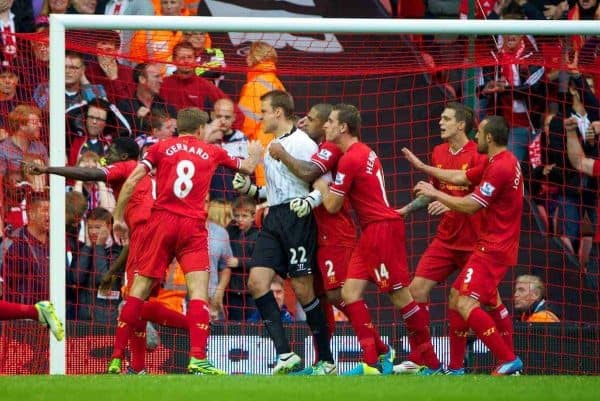 LIVERPOOL, ENGLAND - Saturday, August 17, 2013: Liverpool's goalkeeper Simon Mignolet celebrates with team-mates after saving a late Stoke City penalty during the Premiership match at Anfield. (Pic by David Rawcliffe/Propaganda)