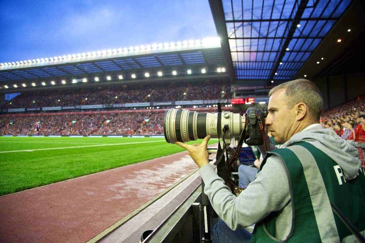 LIVERPOOL, ENGLAND - Tuesday, August 27, 2013: Press Association (PA) photographer Peter Byrne covers Liverpool versus Notts County during the Football League Cup 2nd Round match at Anfield. (Pic by David Rawcliffe/Propaganda)