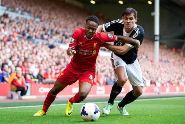 LIVERPOOL, ENGLAND - Saturday, September 21, 2013: Liverpool's Raheem Sterling and Southampton's Dejan Lovren during the Premiership match at Anfield. (Pic by David Rawcliffe/Propaganda)