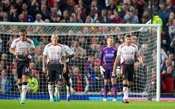 MANCHESTER, ENGLAND - Wednesday, September 25, 2013: Liverpool's captain Steven Gerrard looks dejected as Manchester United score the opening goal during the Football League Cup 3rd Round match at Old Trafford. (Pic by David Rawcliffe/Propaganda)