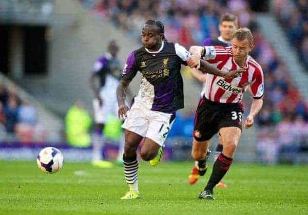 SUNDERLAND, ENGLAND - Sunday, September 29, 2013: Liverpool's Victor Moses in action against Sunderland's Lee Cattermole during the Premiership match at the Stadium of Light. (Pic by David Rawcliffe/Propaganda)