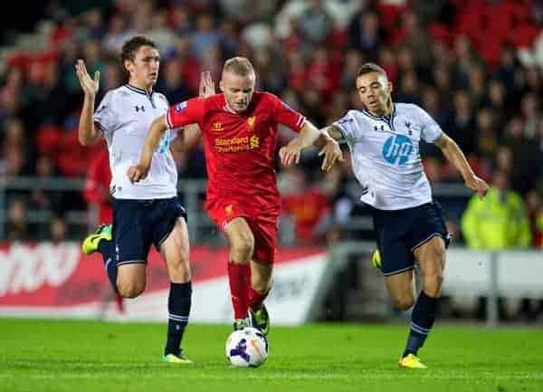 ST HELENS, ENGLAND - Monday, October 7, 2013: Liverpool's Ryan McLaughlin in action against Tottenham Hotspur's Ryan Fredericks during the Under 21 FA Premier League match at Langtree Park. (Pic by David Rawcliffe/Propaganda)