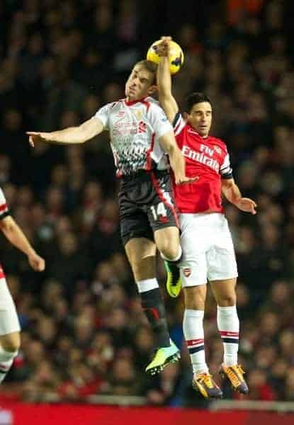 LONDON, ENGLAND - Saturday, November 2, 2013: Liverpool's Jordan Henderson in action against Arsenal's captain Mikel Arteta during the Premiership match at the Emirates Stadium. (Pic by David Rawcliffe/Propaganda)