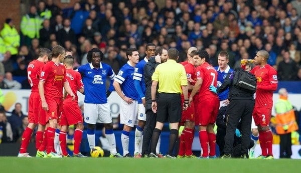 LIVERPOOL, ENGLAND - Saturday, November 23, 2013: Players react after Luis Suarez was tackled during the 221st Merseyside Derby Premiership match against Everton at Goodison Park. (Pic by David Rawcliffe/Propaganda)