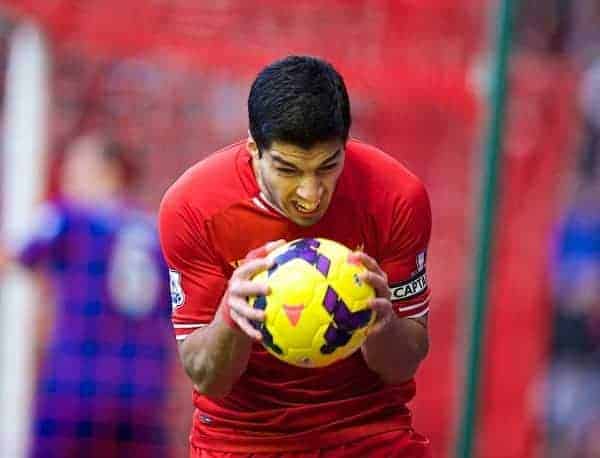 LIVERPOOL, ENGLAND - Saturday, December 21, 2013: Liverpool's Luis Suarez looks dejected after missing a chance for this third goal against Cardiff City during the Premiership match at Anfield. (Pic by David Rawcliffe/Propaganda)