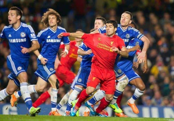 LONDON, ENGLAND - Sunday, December 29, 2013: Liverpool's Luis Suarez has his shirt pulled by Chelsea's captain John Terry but no penalty is given during the Premiership match at Stamford Bridge. (Pic by David Rawcliffe/Propaganda)