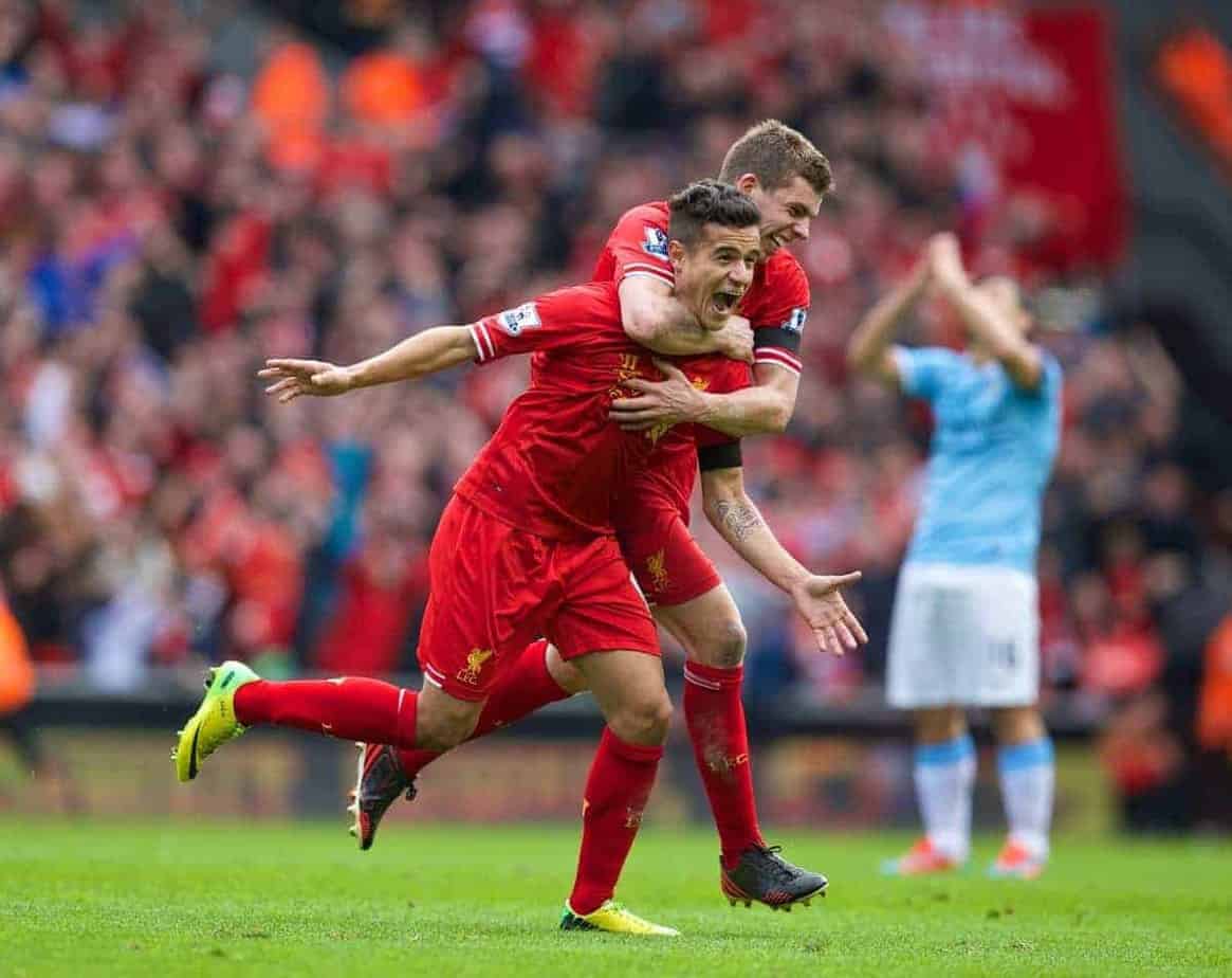 LIVERPOOL, ENGLAND - Sunday, April 13, 2014: Liverpool's Philippe Coutinho Correia celebrates scoring the winning third goal against Manchester City with team-mate Jon Flanagan during the Premiership match at Anfield. (Pic by David Rawcliffe/Propaganda)