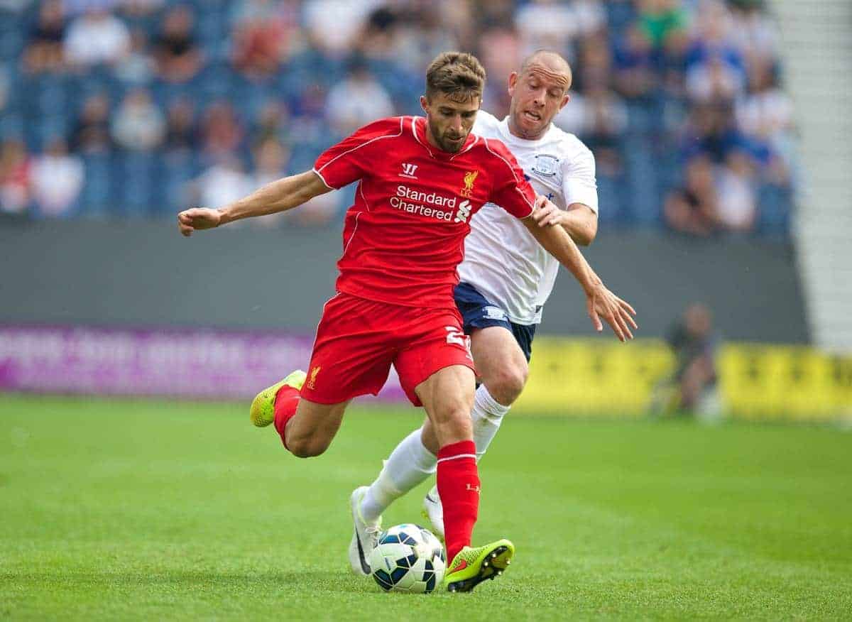 PRESTON, ENGLAND - Saturday, July 19, 2014: Liverpool's Fabio Borini in action against Preston North End's Keith Keane during a preseason friendly match at Deepdale Stadium. (Pic by David Rawcliffe/Propaganda)