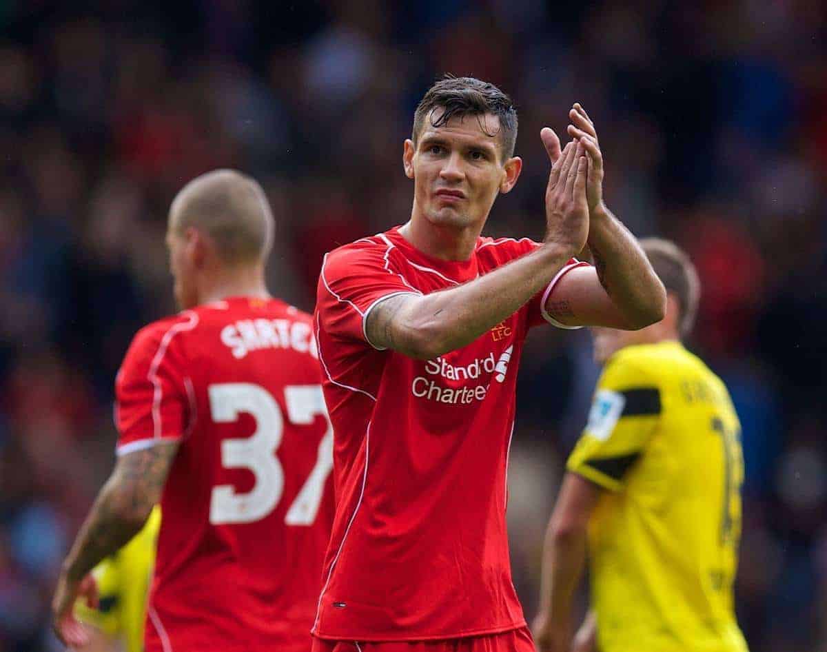 LIVERPOOL, ENGLAND - Sunday, August 10, 2014: Liverpool's Dejan Lovren applauds the supporters after his first game, and goal, for the club during a preseason friendly match against Borussia Dortmund at Anfield. (Pic by David Rawcliffe/Propaganda)