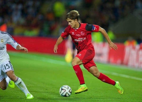 CARDIFF, WALES - Tuesday, August 12, 2014: Sevilla's Denis Suarez in action against Real Madrid's Daniel Carvajal during the UEFA Super Cup at the Cardiff City Stadium. (Pic by David Rawcliffe/Propaganda)