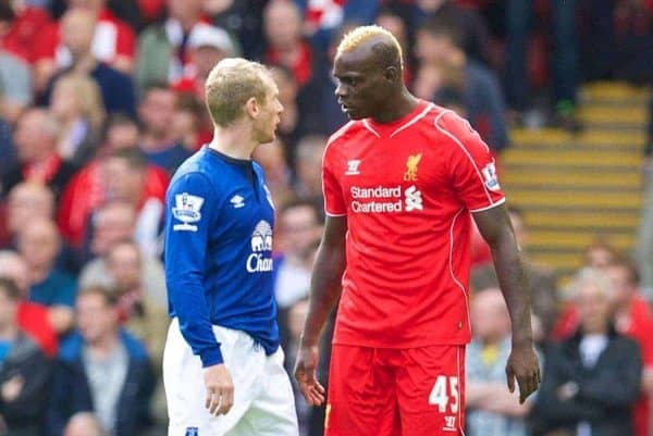 LIVERPOOL, ENGLAND - Saturday, September 27, 2014: Liverpool's Mario Balotelli clashes with Everton's Tony Hibbert during the Premier League match at Anfield. (Pic by David Rawcliffe/Propaganda)