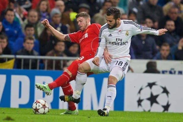 MADRID, SPAIN - Tuesday, November 4, 2014: Liverpool's Alberto Moreno in action against Real Madrid's Nacho during the UEFA Champions League Group B match at the Estadio Santiago Bernabeu. (Pic by David Rawcliffe/Propaganda)