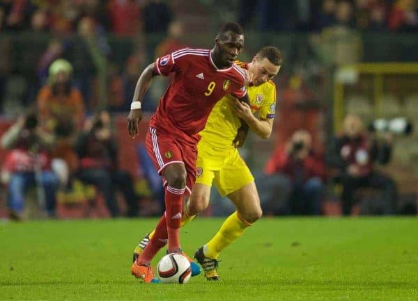 BRUSSELS, BELGIUM - Sunday, November 16, 2014: Wales' James Chester and Belgium's Christian Benteke during the UEFA Euro 2016 Qualifying Group B game at the King Baudouin [Heysel] Stadium. (Pic by David Rawcliffe/Propaganda)