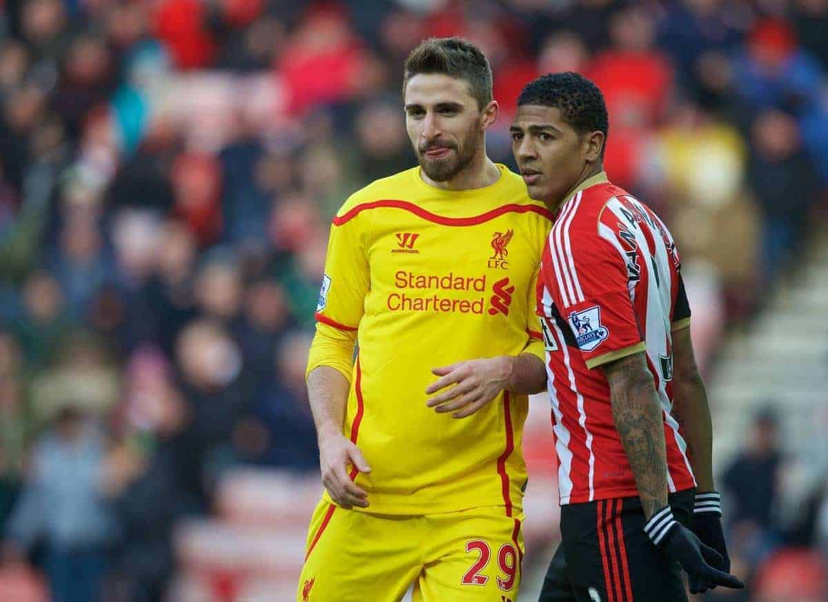 SUNDERLAND, ENGLAND - Saturday, January 10, 2015: Liverpool's Fabio Borini and Sunderland's Patrick van Aanholt during the Premier League match at the Stadium of Light. (Pic by David Rawcliffe/Propaganda)