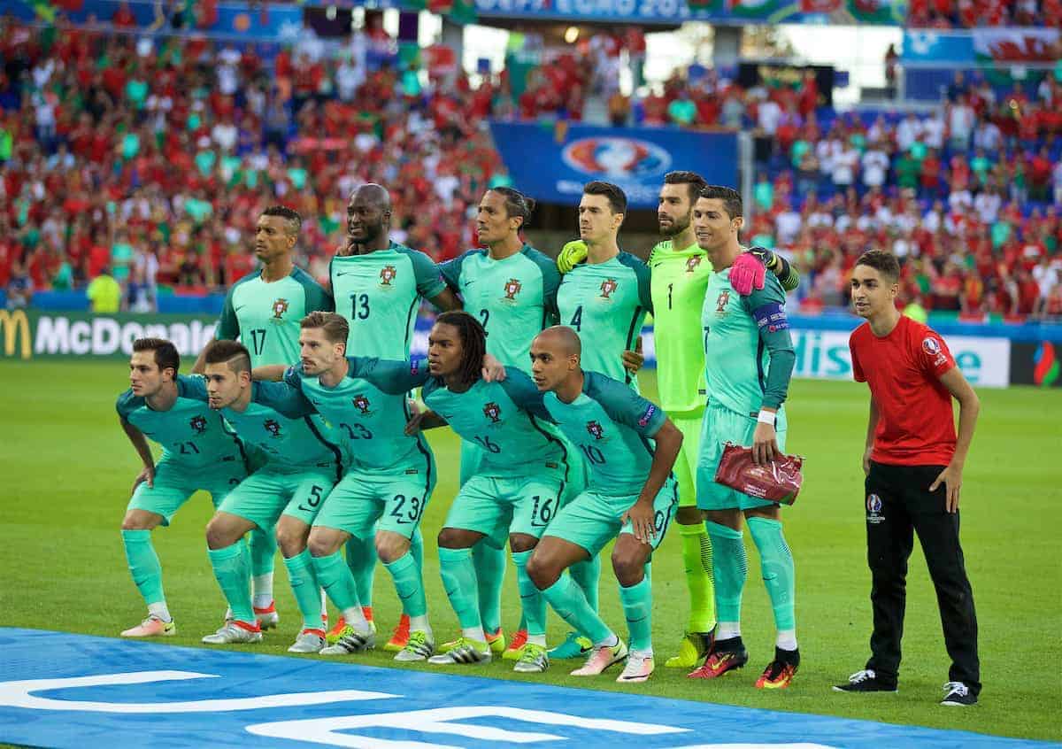 LYON, FRANCE - Wednesday, July 6, 2016: Portugal players line up for a team group photograph, as a volunteer gatecrashes the photo, before the UEFA Euro 2016 Championship Semi-Final match against Wales at the Stade de Lyon. Back row L-R: Luís Carlos Almeida da Cunha ?Nani?, Danilo Luiz da Silva, Bruno Alves, José Fonte, goalkeeper Rui Patrício, captain Cristiano Ronaldo. Front row L-R: Cédric Ricardo Alves Soares, Raphael Guerreiro, Adrien Silva, Renato Sanches, João Mário. (Pic by David Rawcliffe/Propaganda)