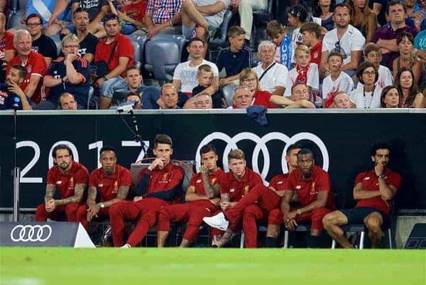 MUNICH, GERMANY - Wednesday, August 2, 2017: Liverpool's unused players Danny Ings, Nathaniel Clyne, goalkeeper Kamil Grabara, Philippe Coutinho Correia, Alberto Moreno, Dejan Lovren, Daniel Sturridge and Mohamed Salah sit on the sidelines during the Audi Cup 2017 final match between Liverpool FC and Atlético de Madrid's at the Allianz Arena. (Pic by David Rawcliffe/Propaganda)