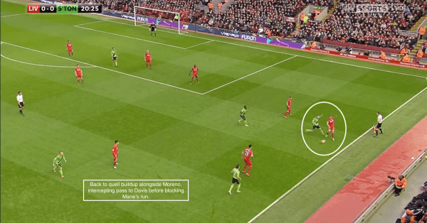 Back to quell buildup alongside Moreno, intercepting pass to Davis before blocking Mane's run.