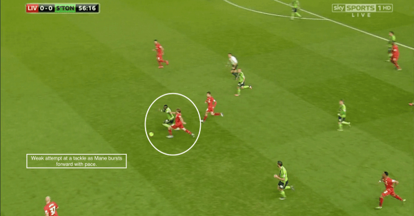 Weak attempt at a tackle as Mane bursts forward with pace.