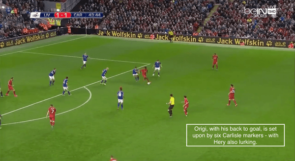 Origi, with his back to goal, is set upon by six Carlisle markers - with Hery also lurking.