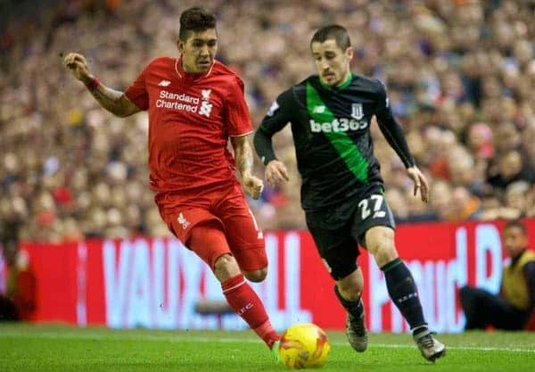 LIVERPOOL, ENGLAND - Monday, January 25, 2016: Liverpool's Roberto Firmino in action against Stoke City's Bojan Krkic during the Football League Cup Semi-Final 2nd Leg match at Anfield. (Pic by David Rawcliffe/Propaganda)