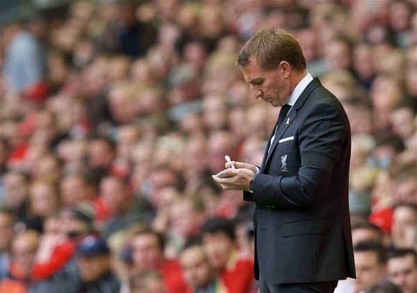 LIVERPOOL, ENGLAND - Sunday, September 20, 2015: Liverpool's manager Brendan Rodgers taking notes during the Premier League match against Norwich City at Anfield. (Pic by David Rawcliffe/Propaganda)