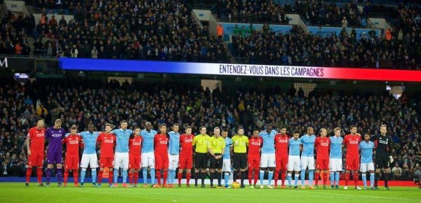 MANCHESTER, ENGLAND - Saturday, November 21, 2015: Liverpool's and Manchester City players stand during the French national anthem before the Premier League match at the City of Manchester Stadium. (Pic by David Rawcliffe/Propaganda)