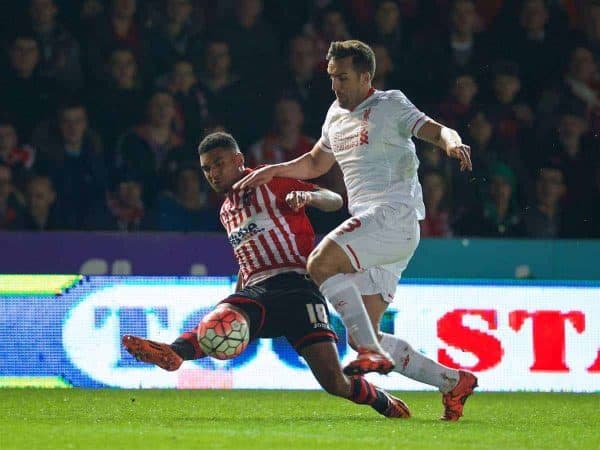 EXETER, ENGLAND - Friday, January 8, 2016: Liverpool's Jose Enrique cannot prevent Exeter City's Jamie Reid setting up the opening goal during the FA Cup 3rd Round match at St. James Park. (Pic by David Rawcliffe/Propaganda)