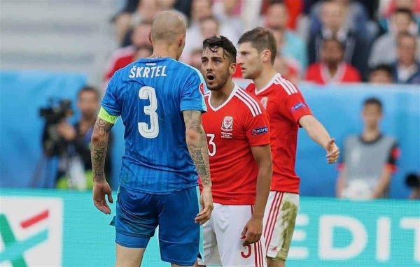 BORDEAUX, FRANCE - Saturday, June 11, 2016: Wales' Neil Taylor goes head-to-head with Slovakia's captain Martin Skrtel during the UEFA Euro 2016 Championship at Stade de Bordeaux. (Pic by David Rawcliffe/Propaganda)