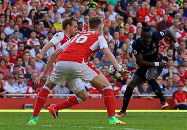 LONDON, ENGLAND - Sunday, August 14, 2016: Liverpool's Sadio Mane in action against Arsenal's Rob Holding during the FA Premier League match at the Emirates Stadium. (Pic by David Rawcliffe/Propaganda)