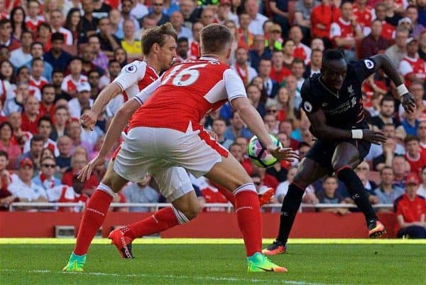 LONDON, ENGLAND - Sunday, August 14, 2016: Liverpool's Sadio Mane in action against Arsenal's Rob Holding during the FA Premier League match at the Emirates Stadium. (Pic by David Rawcliffe/Propaganda)
