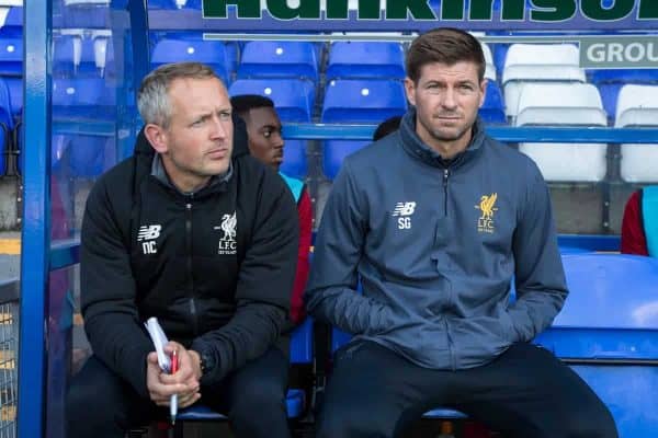 BIRKENHEAD, ENGLAND - Wednesday, September 13, 2017: Liverpool Under 18's manager Steven Gerrard sits on the bench alongside Under 23's coach Neil Critchley ahead of the UEFA Youth League Group E match between Liverpool and Sevilla at Prenton Park. (Pic by Paul Greenwood/Propaganda)