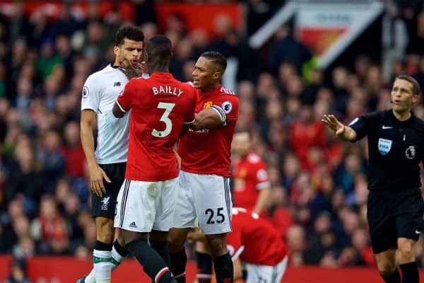 MANCHESTER, ENGLAND - Saturday, March 10, 2018: Liverpool's Dominic Solanke is assaulted by Manchester United's Eric Bailly during the FA Premier League match between Manchester United FC and Liverpool FC at Old Trafford. (Pic by David Rawcliffe/Propaganda)