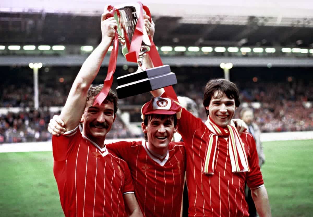 Delighted Liverpool players (from left) Graham Souness, Kenny Dalglish and Alan Hansen celebrate with the Milk Cup trophy after they defeated Manchester United 2-1 in extra time at Wembley. It was Liverpool's third successive triumph in the competition, giving manager Bob Paisley a winning farewell to Wembley etires at the end of the season.